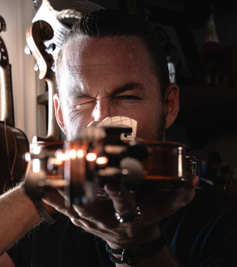 Luthier providing a violin valuation.
