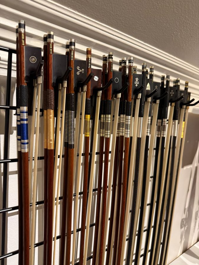 Music Shop Display of Wood Violin Bows and Carbon Fiber Violin Bows