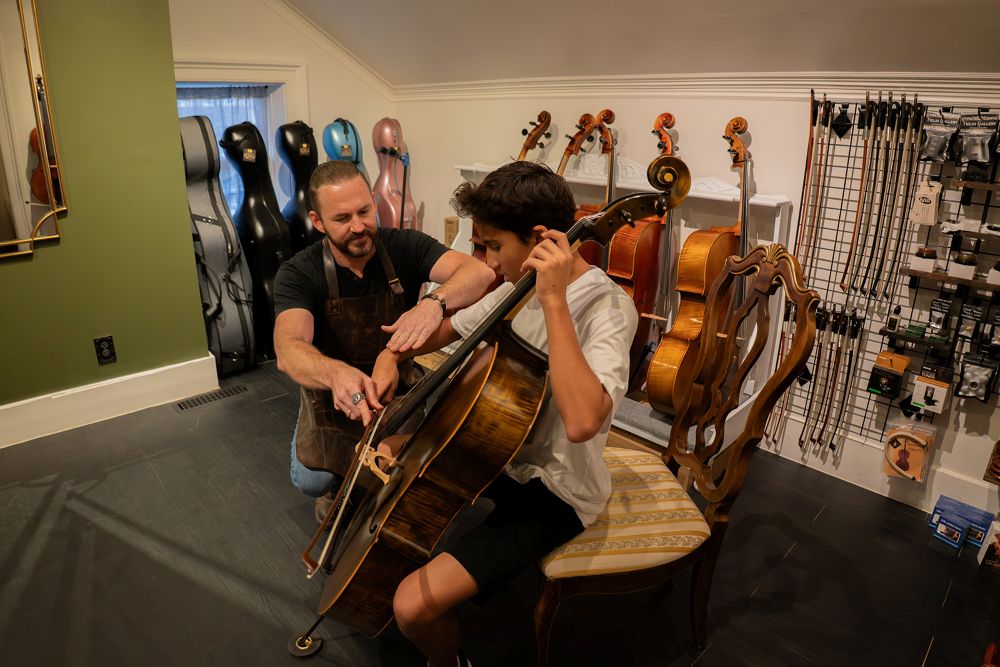 Luthier Helping with Cello Rental in Southern Utah Shop