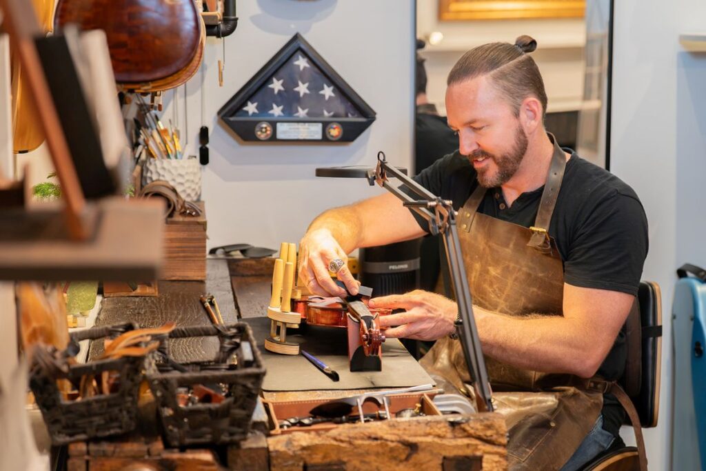Luthier in St. George Utah reparing a violin.